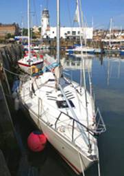 Scarborough Lighthouse and boats in the Harbour